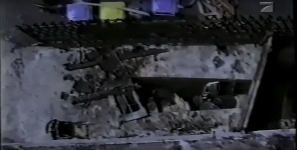 Gursun Ince with her young infant defenestrated a chair with the hope of separating herself from her home by breaking the windowpane and ejecting herself in a desperate but deadly escape. The chair, now seen below the attic window, is left among the rubble where they were both found. The future remembrance placard would be placed next to the same trashcans.